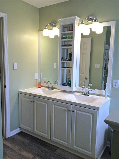 Black, wall mounted vanity, white solid surface top. Master Bathroom vanity sink mirror update - built in ...