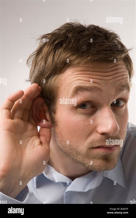 Portrait Of Man Cupping Ear Stock Photo Alamy