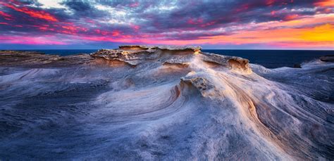 обои пейзаж закат солнца море камень природа Берег Восход