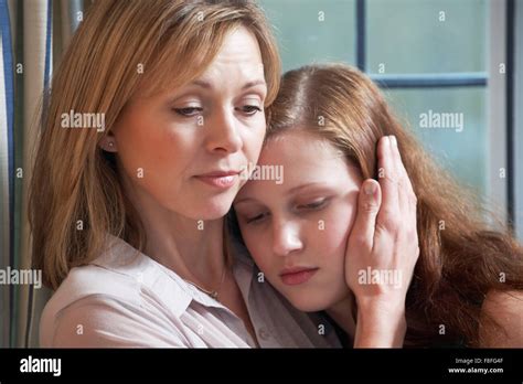 Mother Comforting Teenage Daughter Stock Photo Alamy