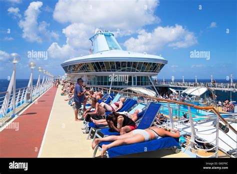 Passengers Relaxing On Board The Cruise Ship Discovery That Belongs To The Thomson Group Stock