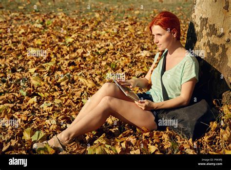Woman Sitting Under Tree Hi Res Stock Photography And Images Alamy