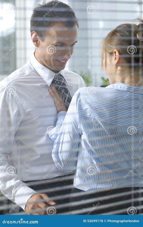 Businesswoman Flirting With His Colleague In Office Stock Photo Image