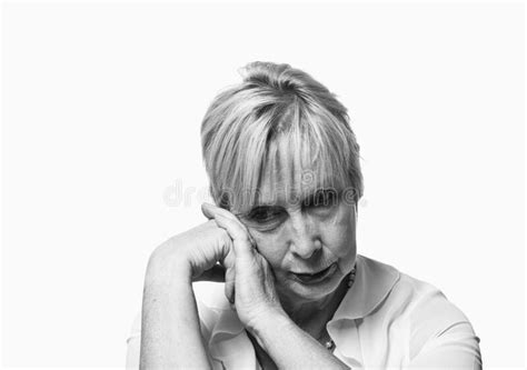 Close Up Of A Mature Senior Woman Suffering Depression And Stress Alone