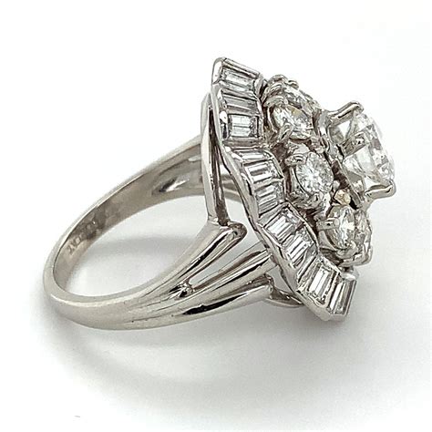 10 irid 90 plat round center and ballerina baguette and round diamond halo ring for sale at