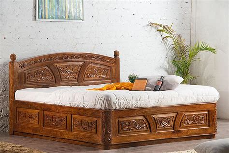 Free same to next day our online furniture store offers you amazing furniture items for bedrooms including beds, chests. Buy Solid Wooden Carving Czar Bed with Storage Online in ...