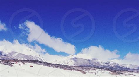 Mountain Covered With Snow Under The Blue Sky By Emily Bruno Photo