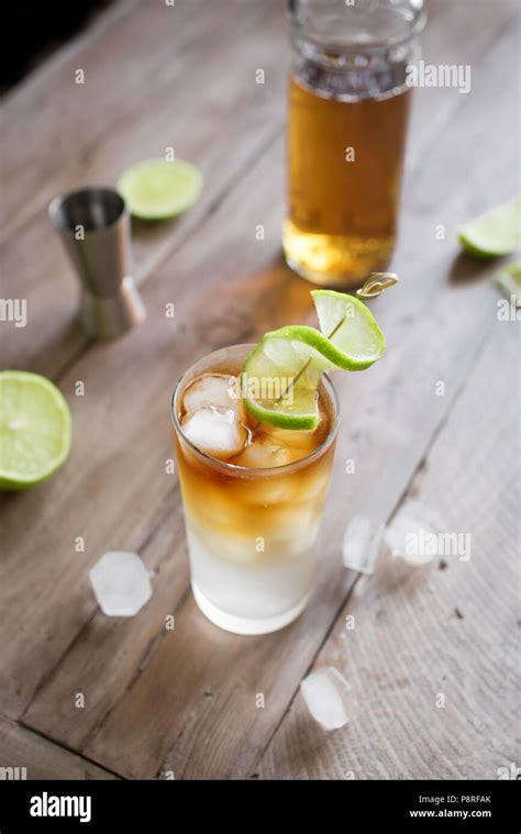 Dark And Stormy Rum Cocktail With Ginger Beer And Lime Garnish Glass Of Dark And Stormy