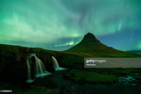 Northern Lights Over Kirkjufellsfoss And Kirkjufell Mountain Iceland