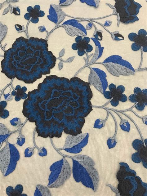 Blue Flower Embroidery With Boarders On Blue Mesh Fabric By