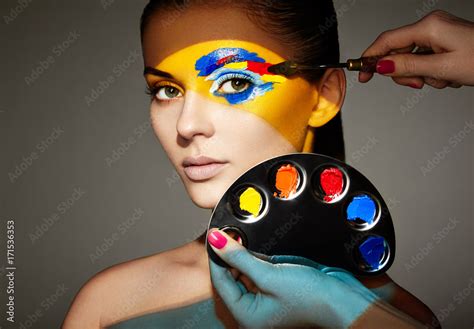 Makeup Artist Applies Colorful Makeup Fashion Model Woman With Colored Face Painted Beauty Art