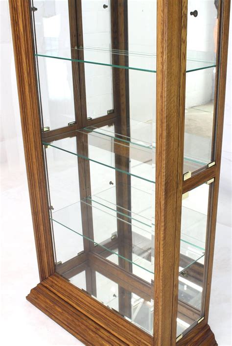 Tall Narrow Side Doors Beveled Glass Oak Curio Display Cabinet At