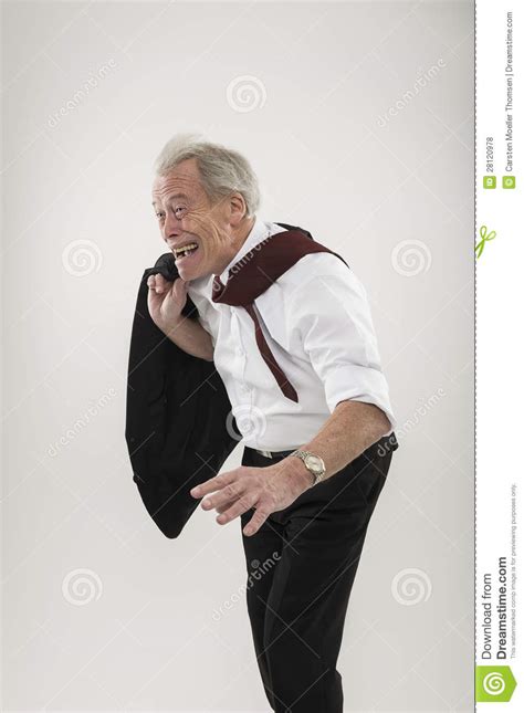 Senior Businessman Leaning Forwards Into Wind Stock Photo Image Of