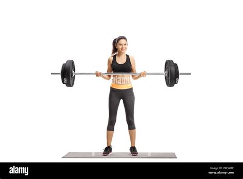 Young Athletic Female Lifting A Barbell Isolated On White Background
