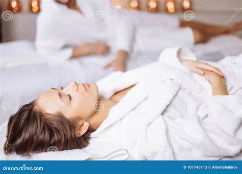 Man And Woman Lying Down On Massage Beds At Luxury Spa And Wellness Center Stock Image Image