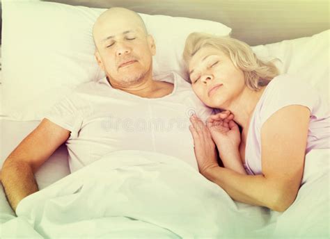 Charming Mature Couple Sleeping On The Bed Stock Image Image Of