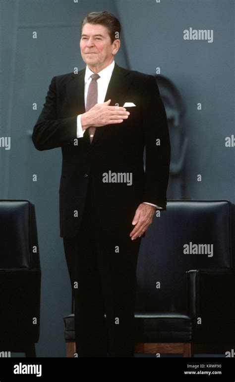 President Ronald Reagan Stands As The National Anthem Is Played During