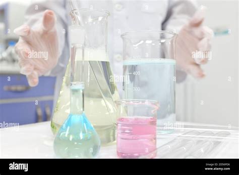 Selective Focus Of Colorful Liquid Chemicals In Glass Beaker Flask And