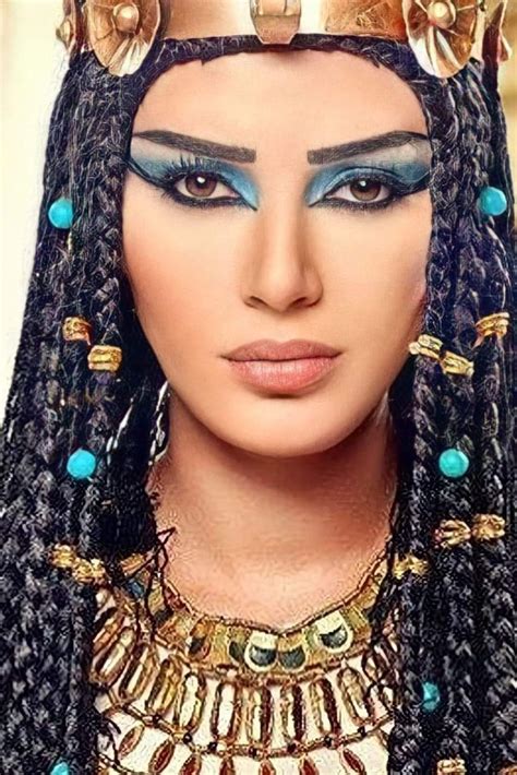 An Egyptian Woman With Blue Eyes And Gold Jewelry On Her Head Wearing