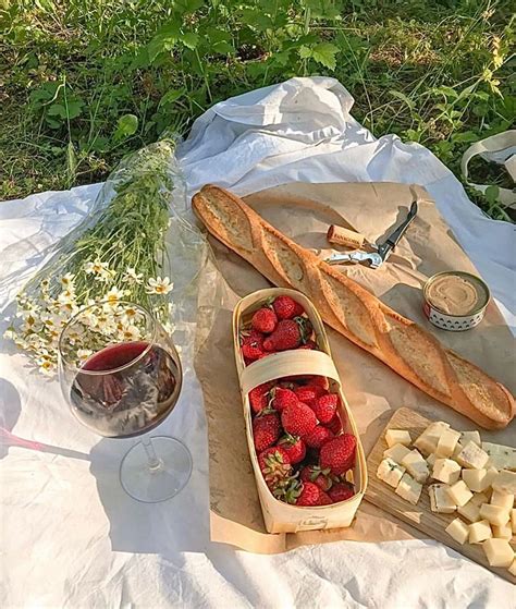 Strawberries Cheese And Bread On A Picnic Blanket