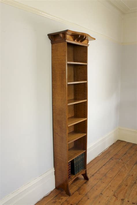 The bookcase having four adjustable shelves flanked by gilded columns all raised up on plinth base. Arts And Crafts Tall Narrow Open Oak Bookcase - Antiques Atlas