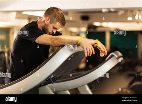 Tired Guy Walking On A Treadmill Exhausted Man Reating Stock Photo Alamy