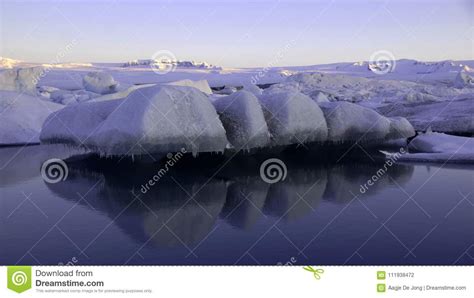 Floating Ice On Jokulsarlon Glacier Lake In Ultraviolet At Sunrise