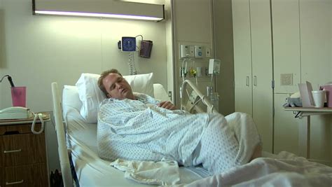 Man Sick In Hospital Bed