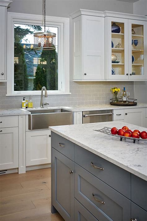 7 paint colors we're loving for kitchen cabinets in 2020. Gray island paint color is Benjamin Moore Grey Pinstripe ...