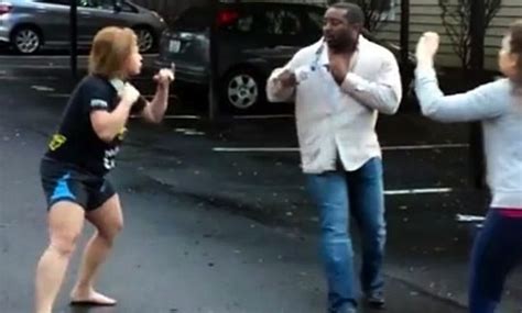 VIDEO Crazy Woman Picks Fight With Man Twice Her Size In Parking Lot