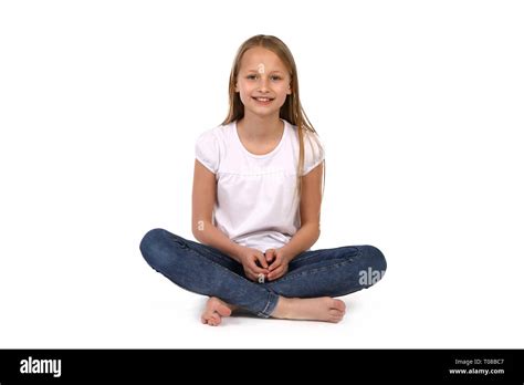 Happy Girl Sitting Cross Legged Stock Photo Alamy