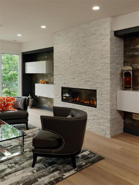 This stone fireplace in a home in austria, designed by hpsa. Floating shelves on either side of this white stone ...
