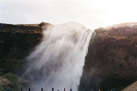 Free Download Group People Raging Waterfalls Near Daytime