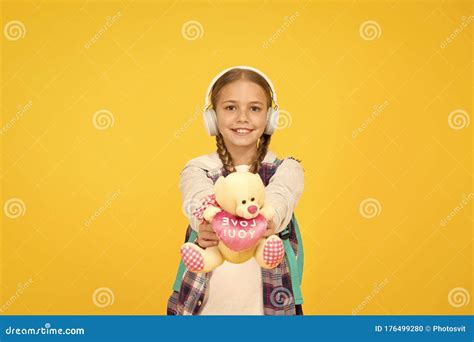 favorite toy energetic cheerful teen listening music stylish schoolgirl going to school girl