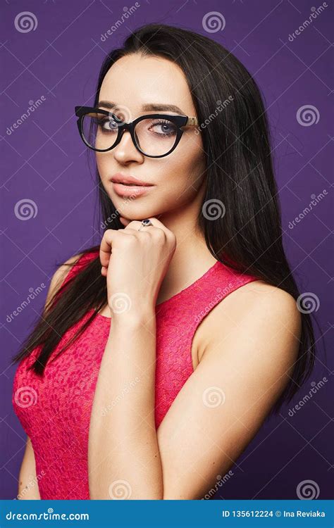 Portrait Of Beautiful Brunette Model Girl With Professional Makeup In Fashionable Black Glasses