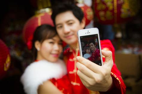 Lovely Couple Selfie Photo By Smartphone With Red Paper Chinese Stock