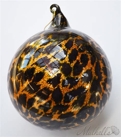 These stunning glass ornaments are perfect for filling the branches on your tree with decorations that will shimmer in the light. Animal print glass ornament featured on the Safari themed ...