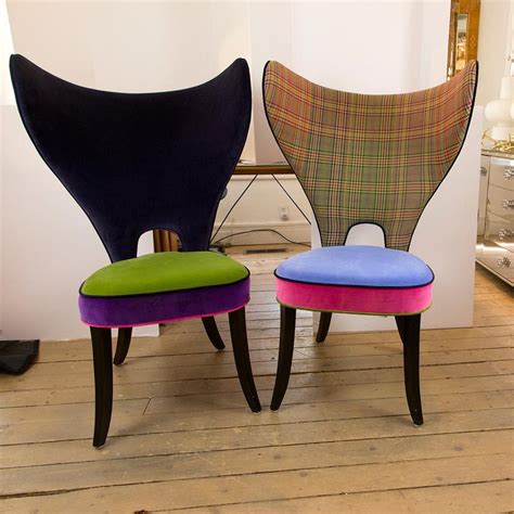 This barrel chair with wide, extended arms and plush fabric invites you to settle in and stay a while. Pair of Unique Multi-Fabric Colorful Upholstered Modern Wing Chairs at 1stDibs
