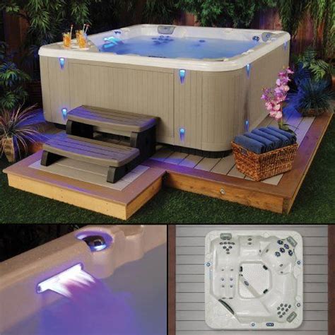 An Outdoor Hot Tub With Lights On It