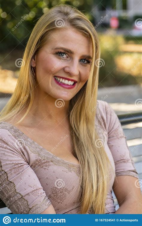 A Lovely Blonde Model Enjoys A Summers Day Outdoors At The Park Stock Image Image Of Body