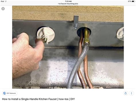 Slide a basin wrench up to one of the nuts that are holding the base to the sink. How to fix the base of a kitchen faucet that moves because ...