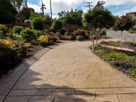 Stamped, colored, engraved, or even inlaid with other materials such as brick and tiling, the cement driveway is anything but standard in the hands of the modern masters. Concrete Driveway Coatings & Overlays Orange County | (714 ...