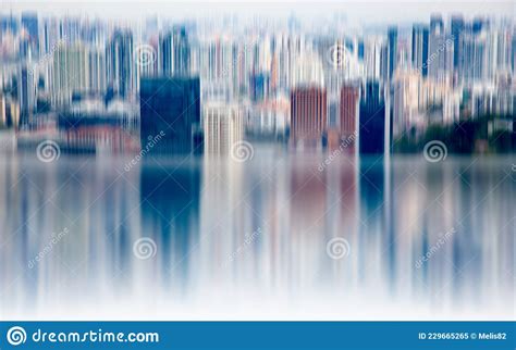 Abstract Background Of Blurred Skyscrapers At Night Business And