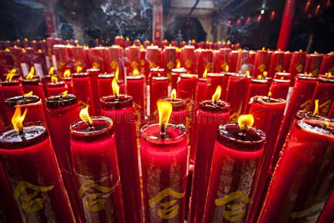 Large Red Candles Are Lit At The Temples To Celebrate Chinese New Year