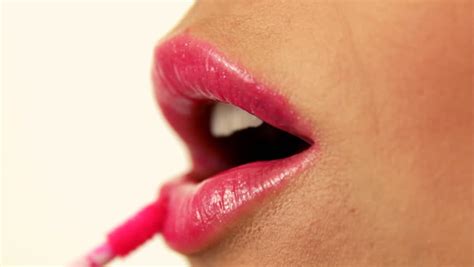 Stock Video Of Woman Applying Pink Lip Gloss Close