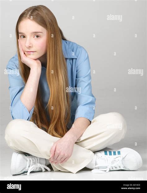 Bored Teenaged Girl Sitting Cross Legged Stock Photo Alamy