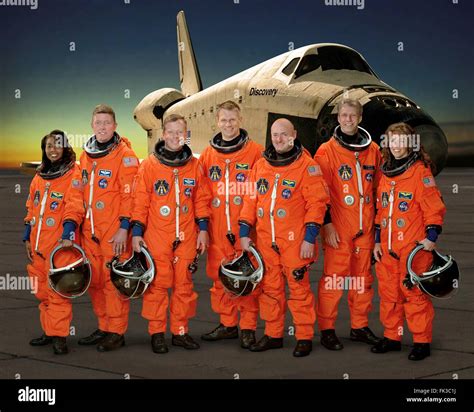 Group Portrait Of The Sts 121 Space Shuttle Crew Astronauts In Orange