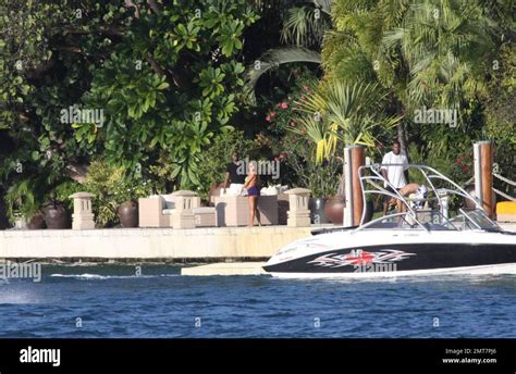 EXCLUSIVE Hip Hop Mogul Sean P Diddy Combs Enjoys A Glass Of Wine And A Smoke On The Dock Of