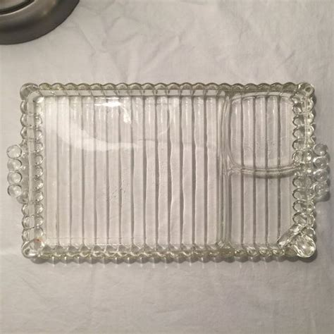 An Empty Glass Tray Sitting On Top Of A Table