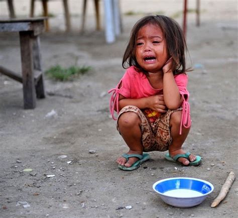 Quezon City Philipines A Child Cries As She Awaits Free Food Photo
